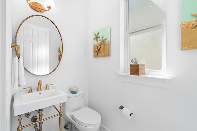 bathroom with sink and toilet