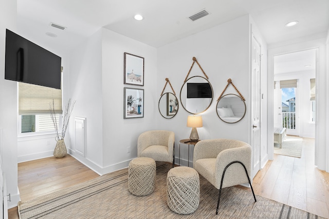 living area featuring light hardwood / wood-style floors