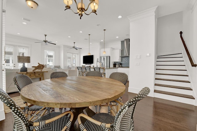 dining room with a notable chandelier and dark hardwood / wood-style flooring