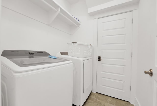 washroom with washer and dryer