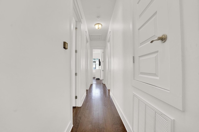 hall with dark hardwood / wood-style floors