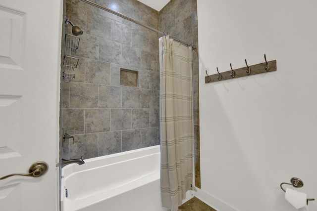 bathroom featuring shower / bath combo with shower curtain