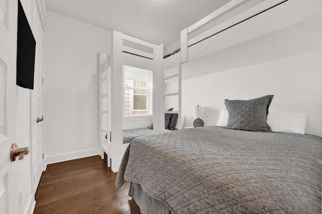 bedroom featuring dark wood-type flooring