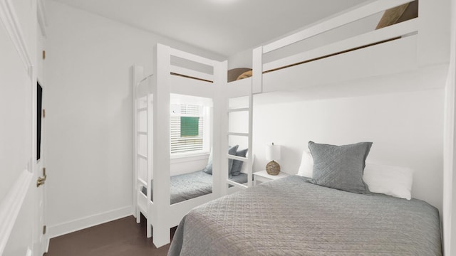 bedroom with french doors and dark hardwood / wood-style flooring