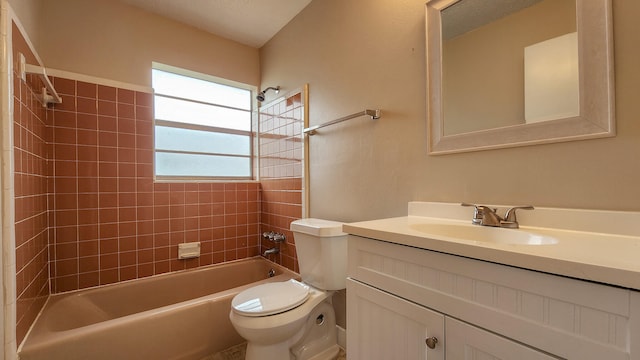 full bathroom with vanity, toilet, and tiled shower / bath