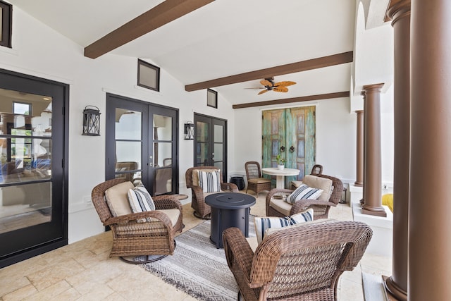 sunroom with vaulted ceiling with beams, ceiling fan, decorative columns, and french doors