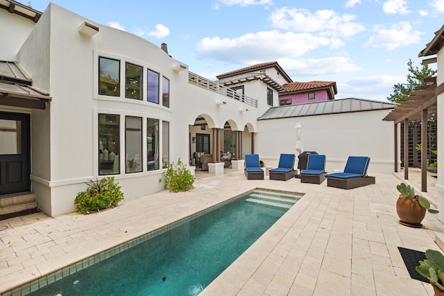 back of property featuring a patio, outdoor lounge area, and a pergola