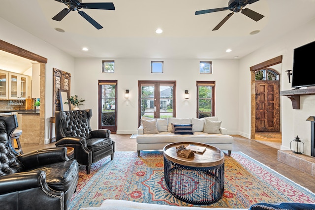 tiled living room with ceiling fan