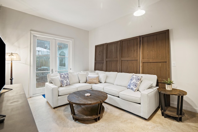 tiled living room with french doors and a wealth of natural light