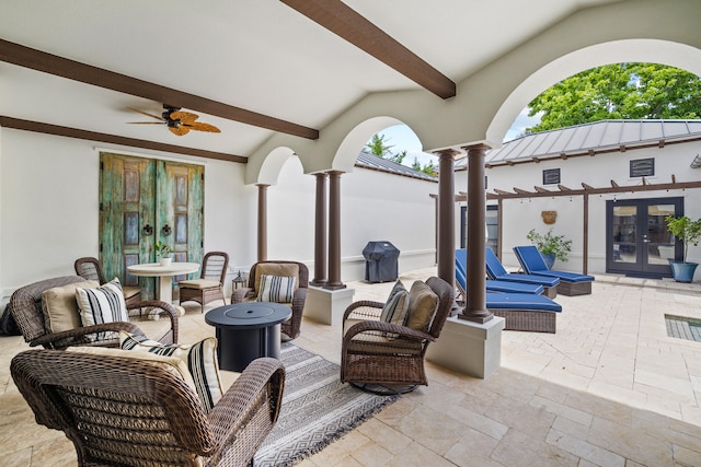 view of patio with french doors and ceiling fan