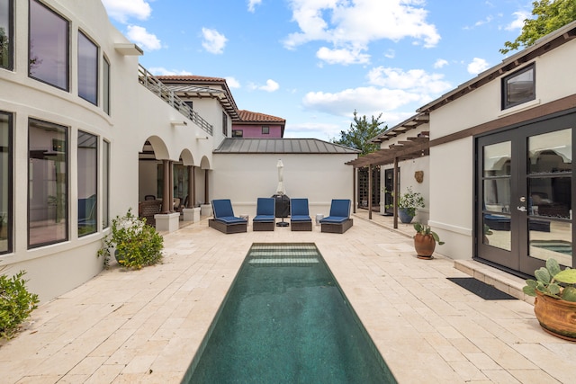 exterior space with a patio, outdoor lounge area, and french doors