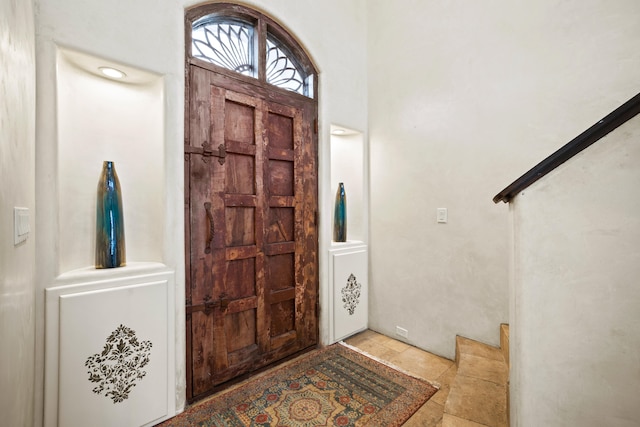 foyer entrance with light tile floors