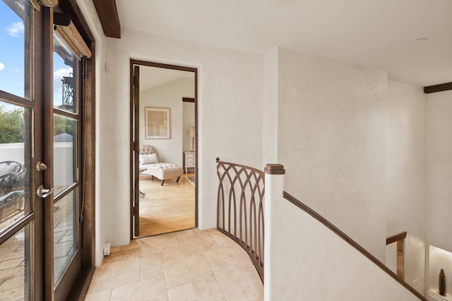 corridor featuring light tile floors