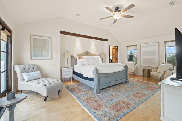 bedroom featuring lofted ceiling, ceiling fan, and light wood-type flooring