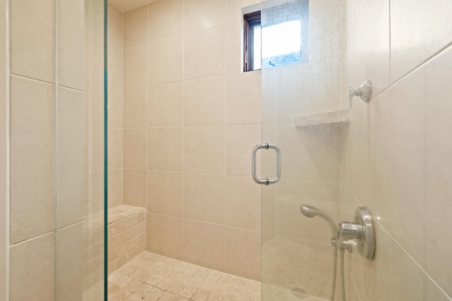 bathroom featuring an enclosed shower