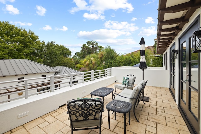 view of patio / terrace with a balcony