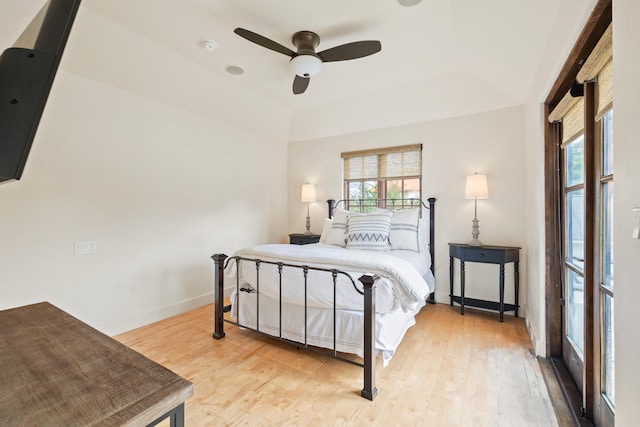 bedroom with light hardwood / wood-style floors and ceiling fan