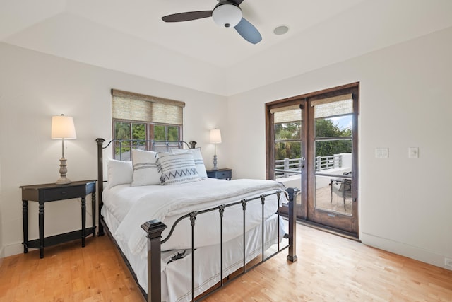 bedroom featuring light hardwood / wood-style flooring, ceiling fan, and access to outside