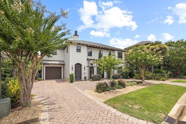 mediterranean / spanish-style house featuring a garage