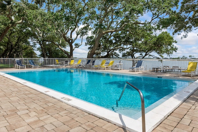 view of swimming pool with a patio