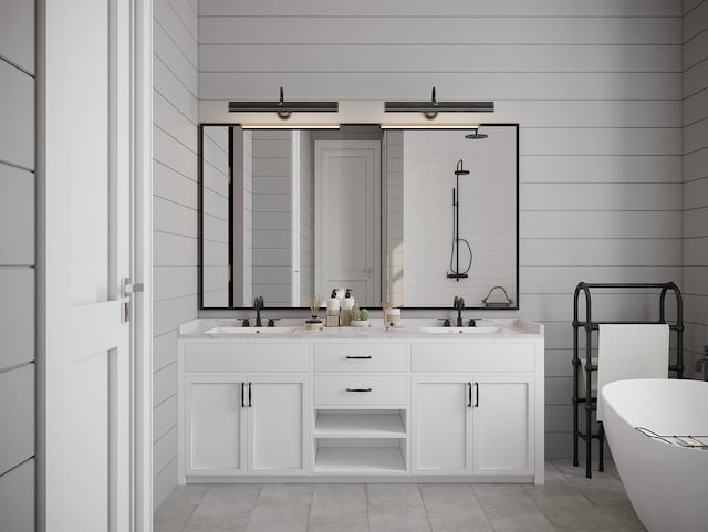 bathroom with a bathing tub, tile floors, and double vanity