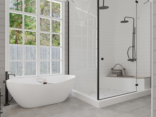 bathroom featuring tile flooring, a healthy amount of sunlight, and an enclosed shower