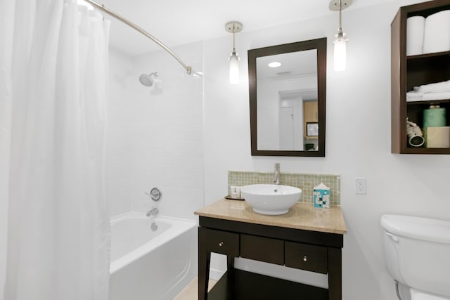 full bathroom with shower / tub combo, vanity, decorative backsplash, and toilet