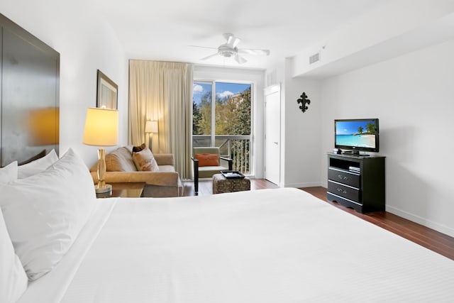 bedroom with dark hardwood / wood-style flooring, access to exterior, and ceiling fan