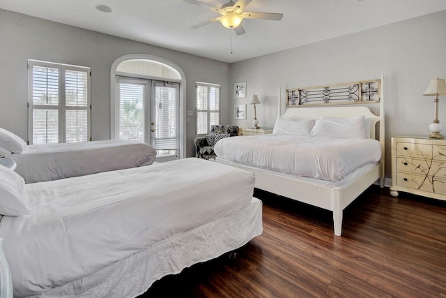 bedroom with ceiling fan, access to outside, dark wood-type flooring, and french doors