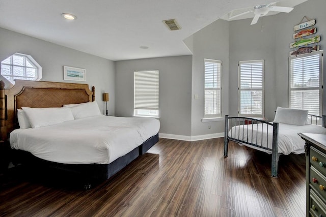 bedroom with ceiling fan and dark hardwood / wood-style flooring