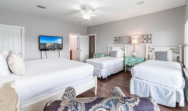 bedroom with ceiling fan and dark hardwood / wood-style floors