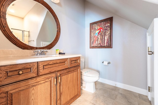 bathroom featuring toilet, vanity, and tile patterned flooring