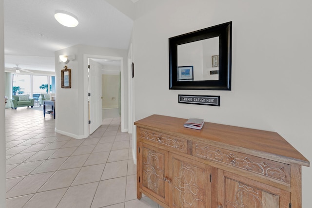 hallway featuring light tile floors