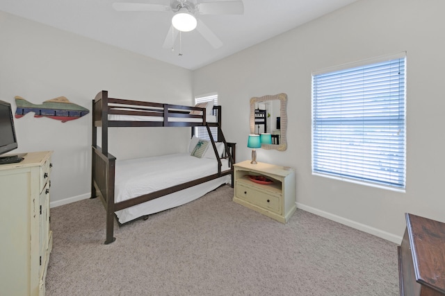 bedroom featuring light colored carpet and ceiling fan