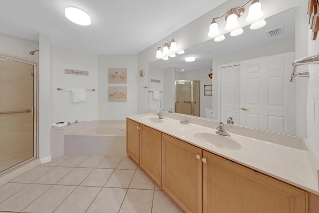 bathroom with tile flooring, separate shower and tub, and dual vanity