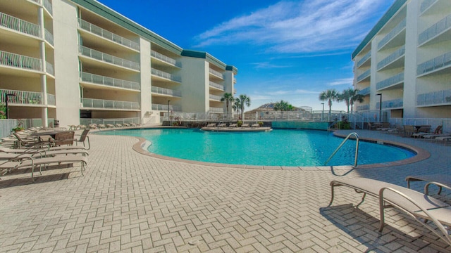 view of swimming pool with a patio