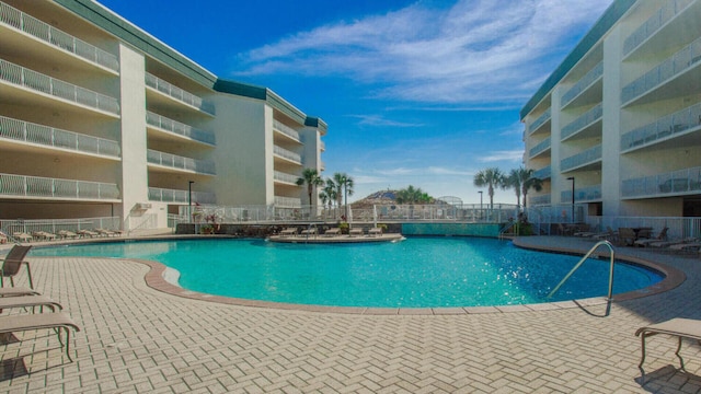 view of swimming pool with a patio