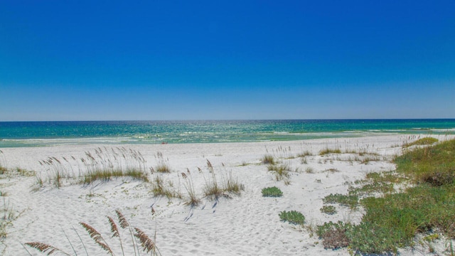 property view of water featuring a beach view