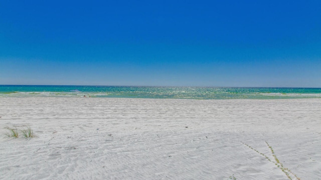 property view of water featuring a beach view