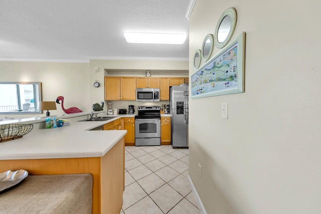 kitchen with appliances with stainless steel finishes, light tile floors, sink, ornamental molding, and kitchen peninsula