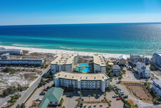 bird's eye view with a water view and a view of the beach