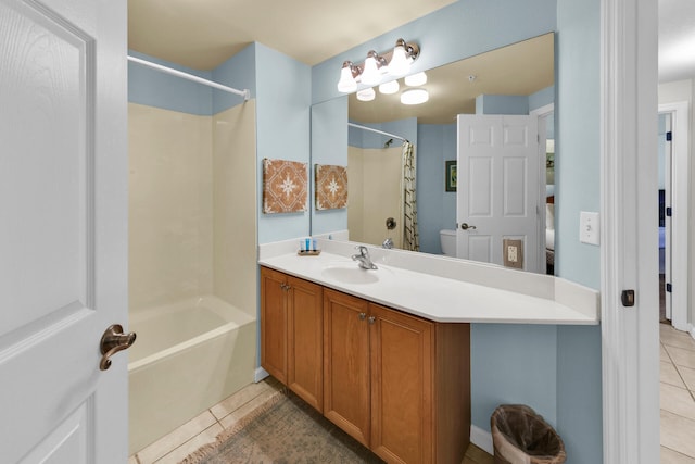 full bathroom featuring vanity with extensive cabinet space, shower / tub combo, toilet, and tile floors