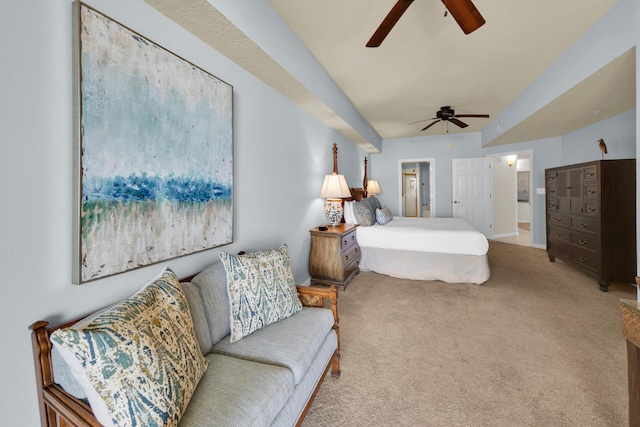 carpeted bedroom featuring connected bathroom and ceiling fan