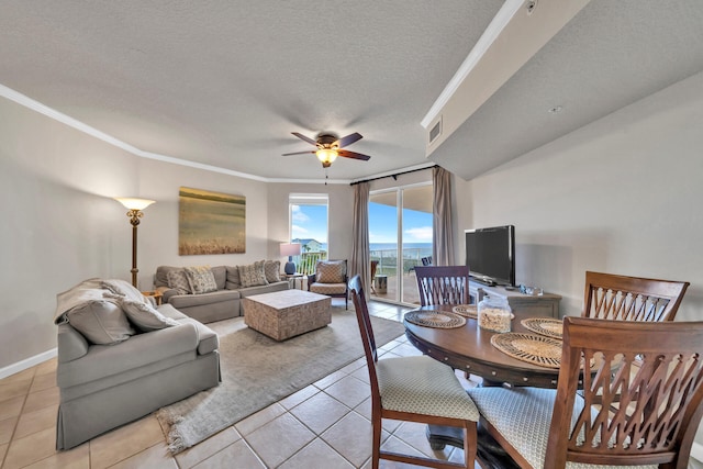 interior space featuring a textured ceiling, ceiling fan, and crown molding