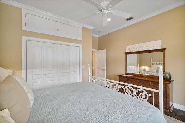 bedroom featuring ornamental molding, a closet, ceiling fan, and dark parquet floors