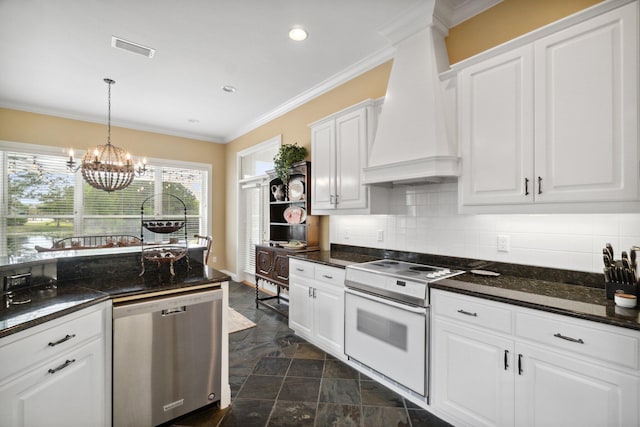 kitchen with white cabinets, a notable chandelier, white electric stove, stainless steel dishwasher, and premium range hood