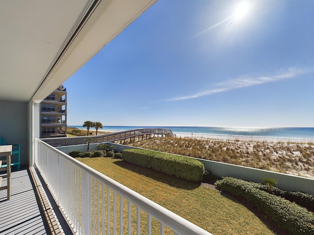 balcony with a view of the beach and a water view