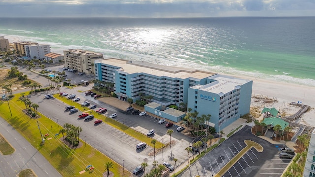 drone / aerial view with a water view and a view of the beach