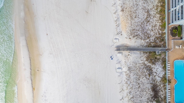 bird's eye view featuring a water view and a view of the beach