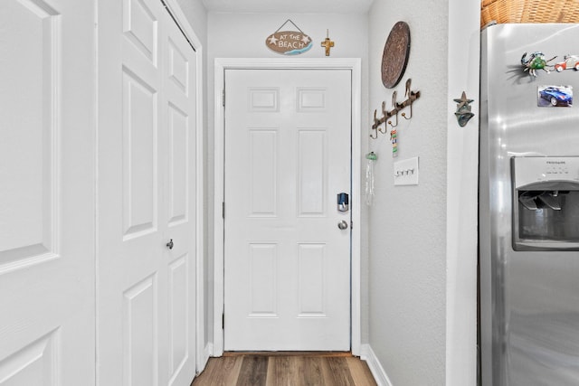 doorway to outside featuring dark hardwood / wood-style flooring